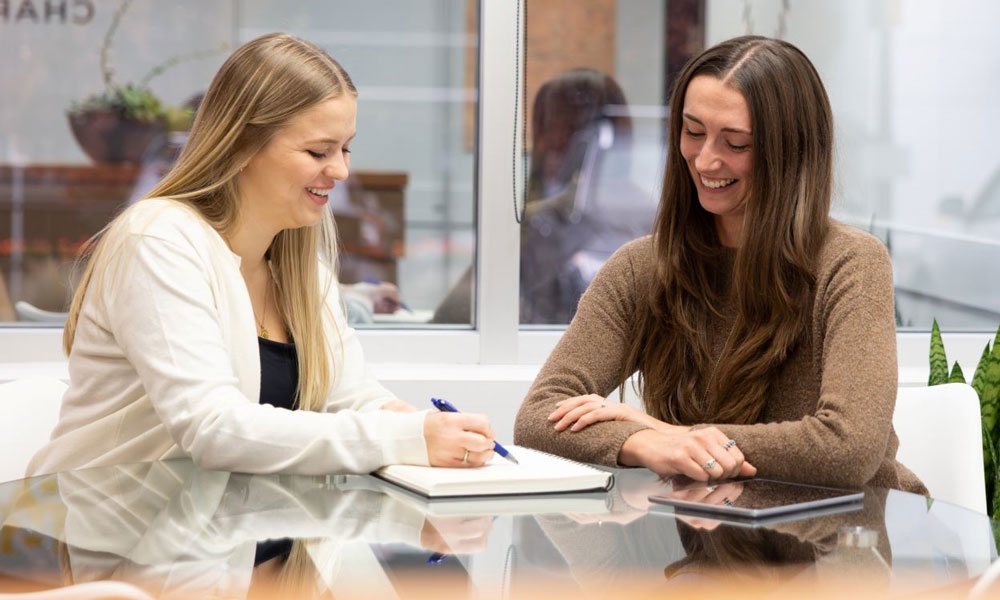 Two students at a table at Third Space Charity.